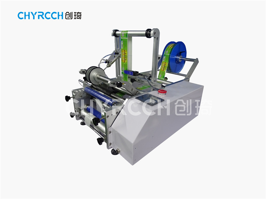半自動圓瓶貼標(biāo)機(jī)圖片