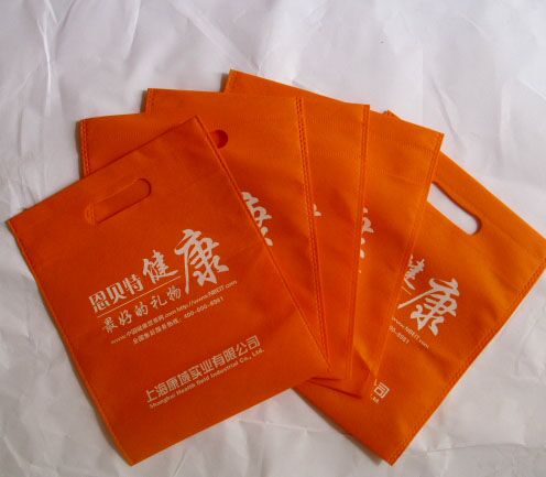 深圳現(xiàn)貨環(huán)保手提沖孔購物定制訂做熱壓車縫排版印刷廣告無紡布袋 無紡布手提袋廠家