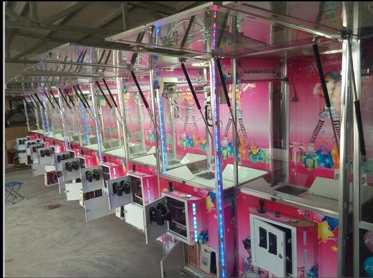 供應(yīng)投幣抓煙機(jī)， 禮品自助販賣機(jī)